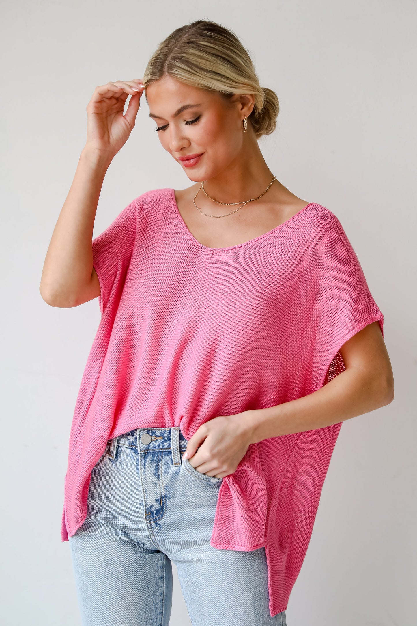 pink Lightweight Knit Top. Eliza Lightweight Knit Top is the perfect spring sweater. Lightweight knit sweater, with v-neck, short sleeves, and oversized fit. Pairs well with denim. Online boutique. 